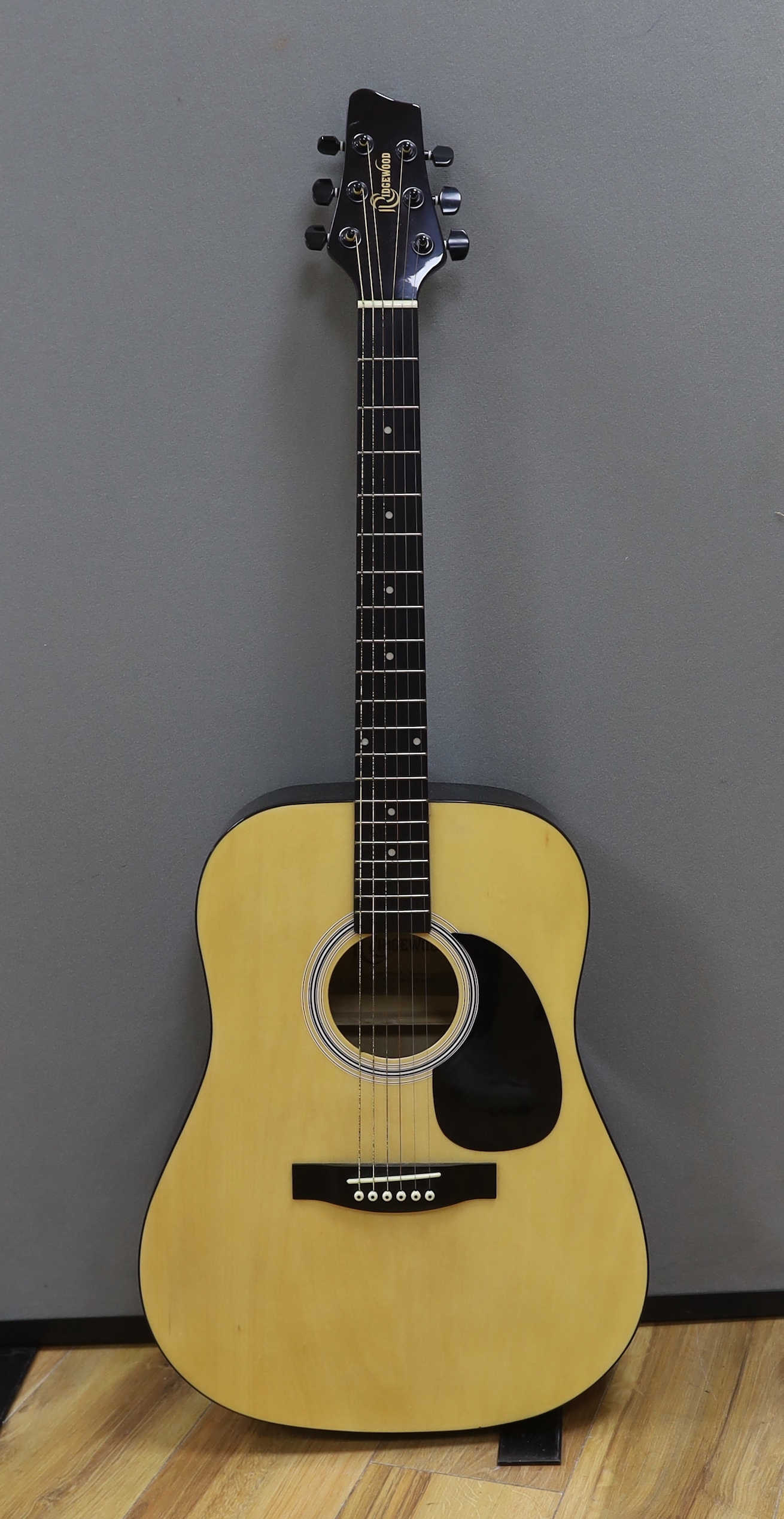 A Rockwood acoustic guitar, in a soft case